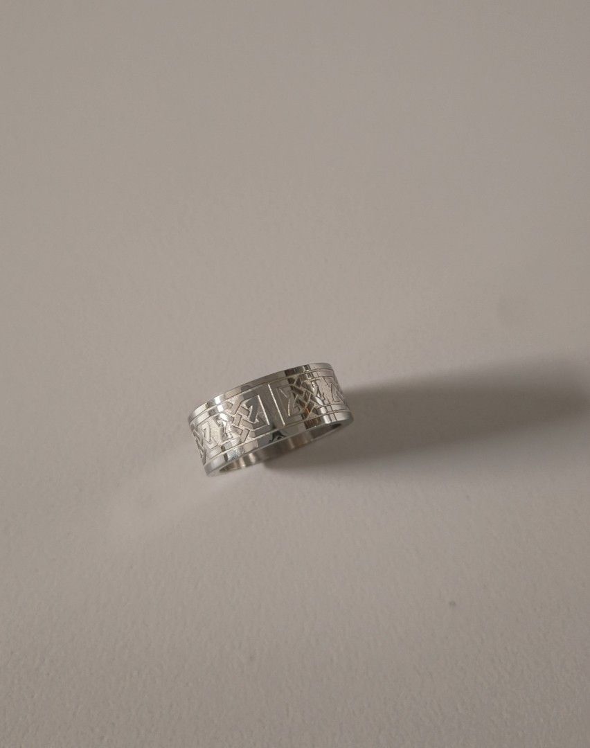 Silver Ring (Category: Jewelry) located in Singapore. Submitted by foret_element (Listing ID 1458378705, Image 1). Description: - Silver ring featuring a detailed Celtic knot pattern. - Unique and eye-catching design. - Comfortable for daily wear. - Adds a stylish touch to any outfit..