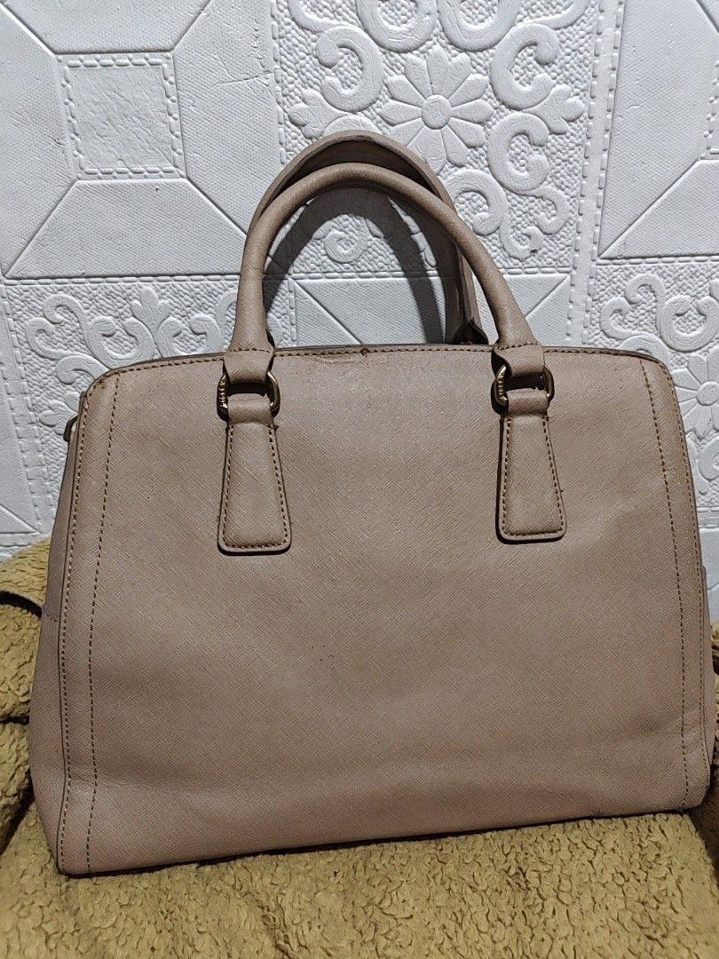 Sisley Taupe Structured Satchel Handbag (Category: Luxury Bags & Wallets) located in Makati City. Submitted by tin_erwin (Listing ID 1458476317, Image 2). Description: - Brand: Sisley - Color: Taupe - Style: Structured Handbag - Hardware: Gold-tone details - Straps: Top handles (missing straps) Use it as handbag nalang - Closure: Zip-top main compartment plus two magnet lock side compartments - Interior: Pockets for organization - Condition: Clea