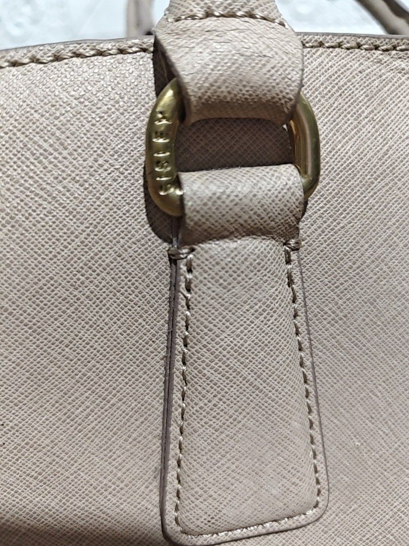 Sisley Taupe Structured Satchel Handbag (Category: Luxury Bags & Wallets) located in Makati City. Submitted by tin_erwin (Listing ID 1458476317, Image 3). Description: - Brand: Sisley - Color: Taupe - Style: Structured Handbag - Hardware: Gold-tone details - Straps: Top handles (missing straps) Use it as handbag nalang - Closure: Zip-top main compartment plus two magnet lock side compartments - Interior: Pockets for organization - Condition: Clea