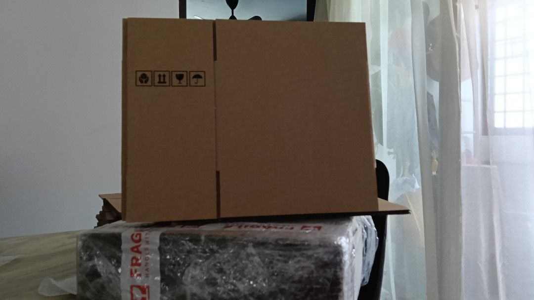 Small boxes (Category: Storage Boxes & Baskets) located in Singapore. Submitted by promiseshop1 (Listing ID 1458318027, Image 1). Description: - Set of 26 small cardboard boxes - Dimensions: 21cm (L) x 11cm (W) x 14.5cm (H) - Sturdy and reliable for shipping or storage - Versatile for various packing needs.
