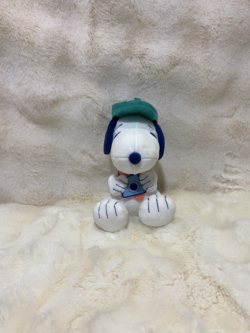 Snoopy Plush Toy with Camera and Green Cap (Category: Plushies & Soft Toys) located in Kalibo. Submitted by ollie_stuffshop (Listing ID 1458423904, Image 1). Description: 17cm x 11cm Before you send your inquiries: ❗️Last Price is already posted ❗️Manage your expectations, WYSIWYG ❗️May need washing ❗️Dropoff is every Wednesday & Sunday - Adorable Snoopy plush toy - Features a green cap and holds a camera - Dressed in a purple vest and orange sca