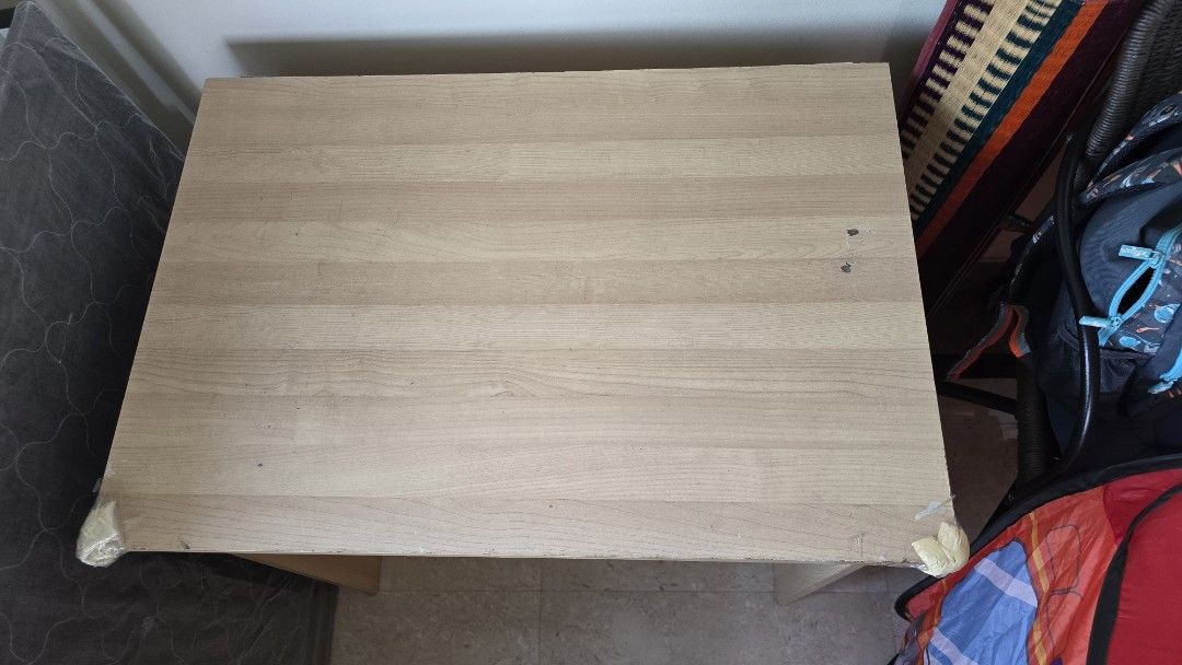 Study Computer Table (Category: Tables & Sets) located in Singapore. Submitted by satman (Listing ID 1458406436, Image 2). Description: - Simple study table - Light wood finish - Minor tape residue on corners (baby protection).