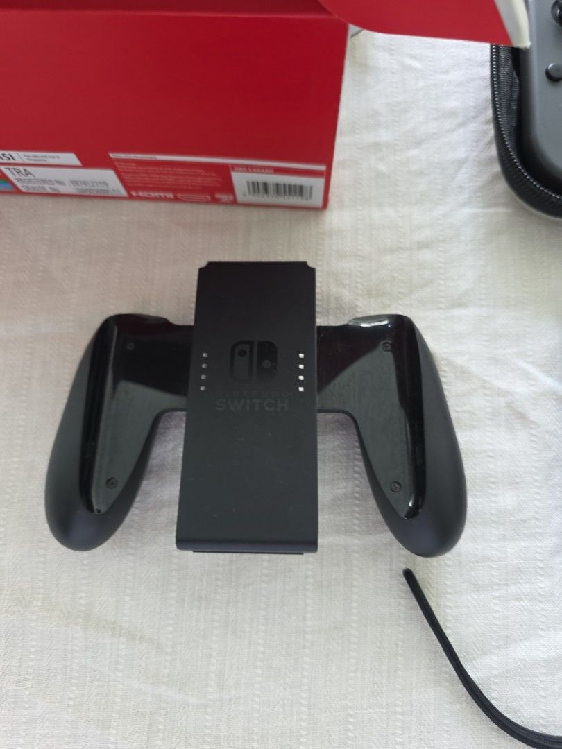 Switch (Category: Nintendo) located in Singapore. Submitted by lylimm (Listing ID 1458330364, Image 3). Description: - Nintendo Switch console - Ready for gaming - Versatile for home and portable play - comes with original box, manuals, full accessories - additional compact pouch for travelling - no dents or scratches, minor blemish - seldom use as upgraded to switch 2 .