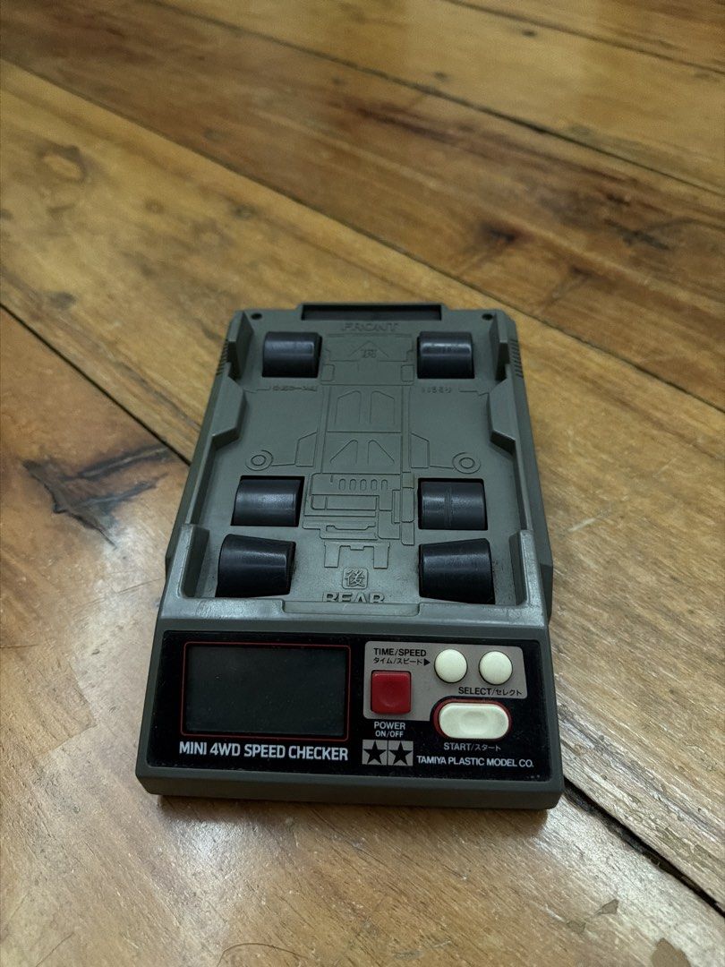 Tamiya Mini 4WD Speed Checker (Category: Vehicle & Diecast Models) located in Quezon City. Submitted by paulus037 (Listing ID 1458428977, Image 1). Description: - Tamiya Mini 4WD Speed Checker - Measures time and speed for your Mini 4WD cars - Features power on/off and select buttons - Made by Tamiya Plastic Model Co. - Essential for racing enthusiasts.