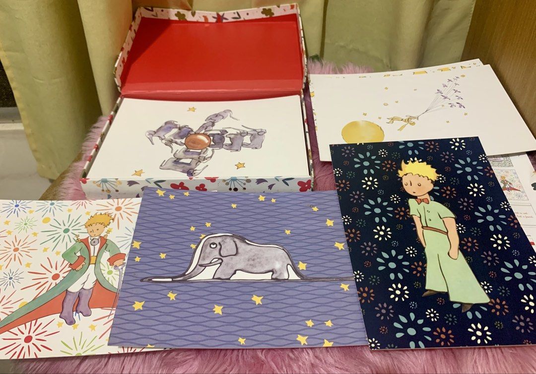 The Little Prince 30 Deluxe Postcards (Category: Storybooks) located in Valenzuela. Submitted by preloved_by_poshspeiz (Listing ID 1458459680, Image 3). Description: The Little Prince 30 Deluxe Postcards - This pre-loved beautiful box contains 30 collectible, frameable, and mailable deluxe postcards. - Complete with never used 30 postcards. Stored in my bookshelf because it’s so pretty to look at. - There are very minimal sign of storage - Price 