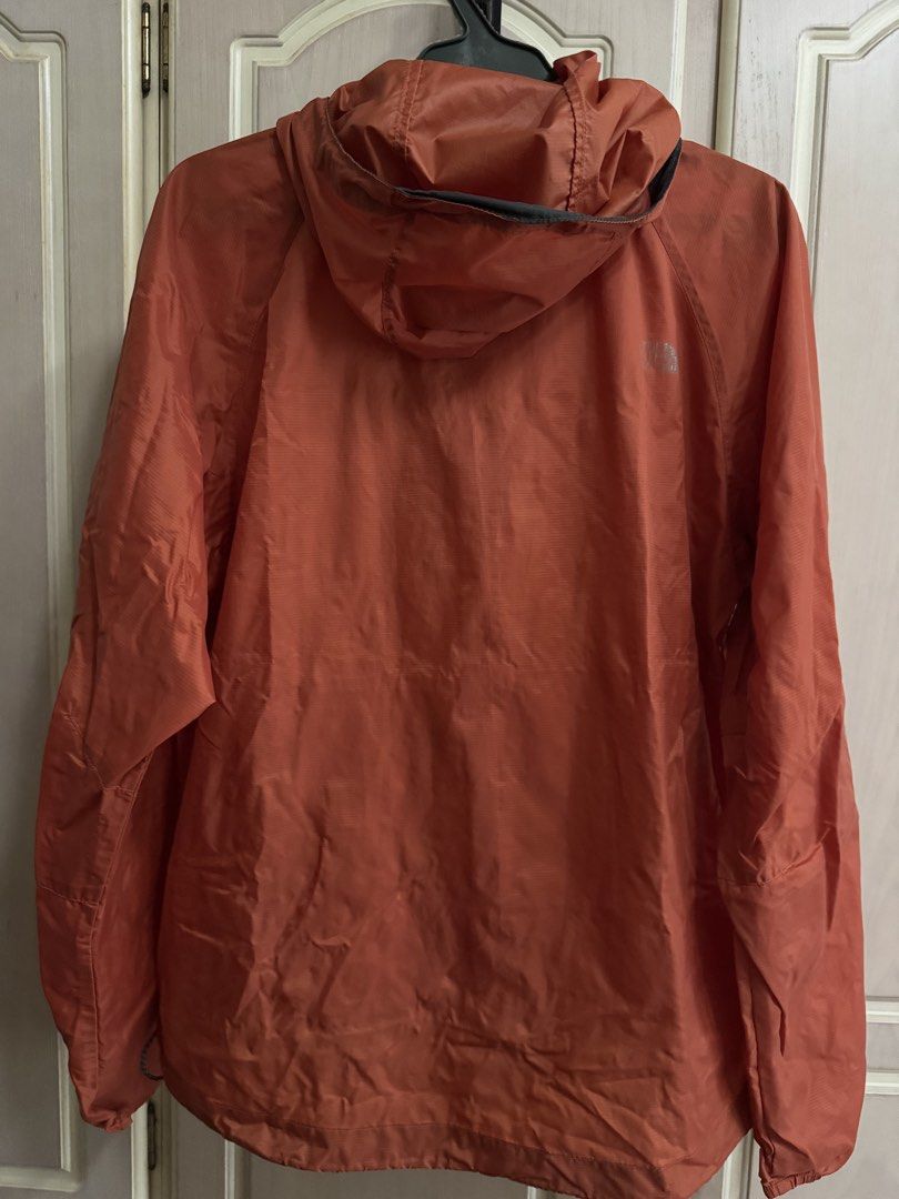 The North Face Orange Lightweight Hooded Jacket (Category: Coats, Jackets and Outerwear) located in Quezon City. Submitted by happibruce (Listing ID 1458365222, Image 3). Description: - Brand: The North Face - Color: Orange - Type: Lightweight Jacket - Features: Hood, Full Zip Closure - Material: 100% Nylon - Size: S/P - Ideal for: Outdoor activities, everyday wear - Additional Benefit: Easy to pack and carry.