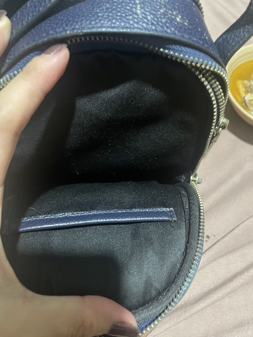 Tory Burch Navy Blue Leather Mini Bag (Category: Luxury Bags & Wallets) located in Marikina City. Submitted by diazjeniel90559 (Listing ID 1458346390, Image 2). Description: /with flaws see on pic - Navy blue Tory Burch mini bag - Pebbled leather material - Zipper closure - Interior: 1 zippered pocket, 1 slip pocket - Exterior: Some wear on handle and edges - Interior: Clean - Condition: Selling as is.