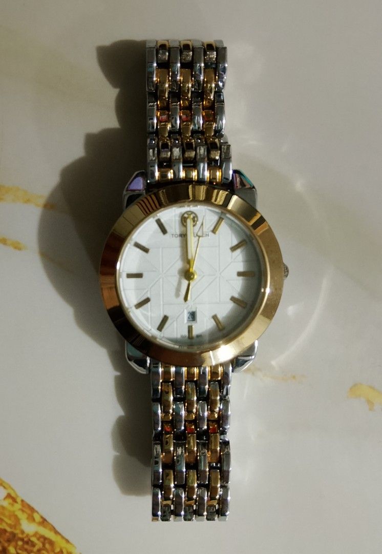 Two-Tone Watch (top grade quality) (Category: Women's Watches) located in Caloocan City. Submitted by fastfox_316d35 (Listing ID 1458449247, Image 1). Description: - Top grade quality watch - Elegant white face with gold accents - Two-tone metal band (silver and gold) - Convenient date window - Versatile classic style for everyday or special occasions - Goes with everything!.