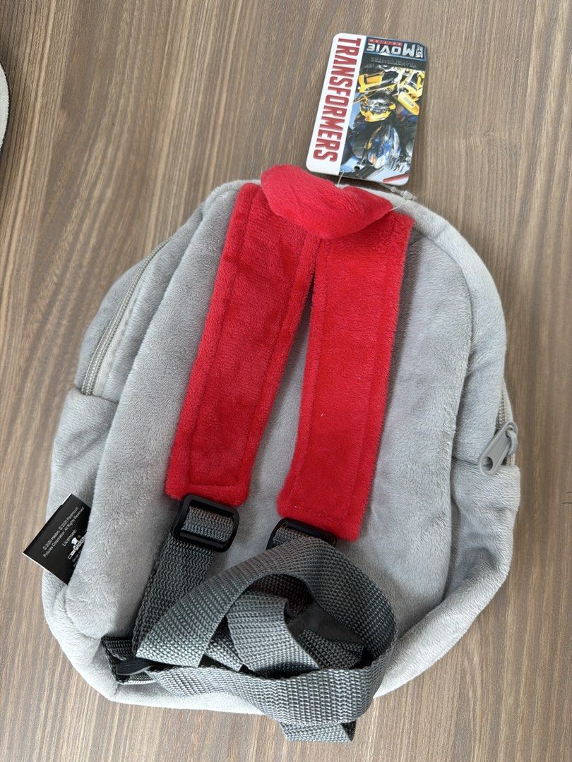 Transformers small backpack (Category: Babies & Kids Fashion) located in Singapore. Submitted by swong26 (Listing ID 1458320663, Image 2). Description: Small and cute Transformer backpack for little ones! Brand new never used! 20cm x 20cm when measured laying flat Grab this steal! Decluttering!.