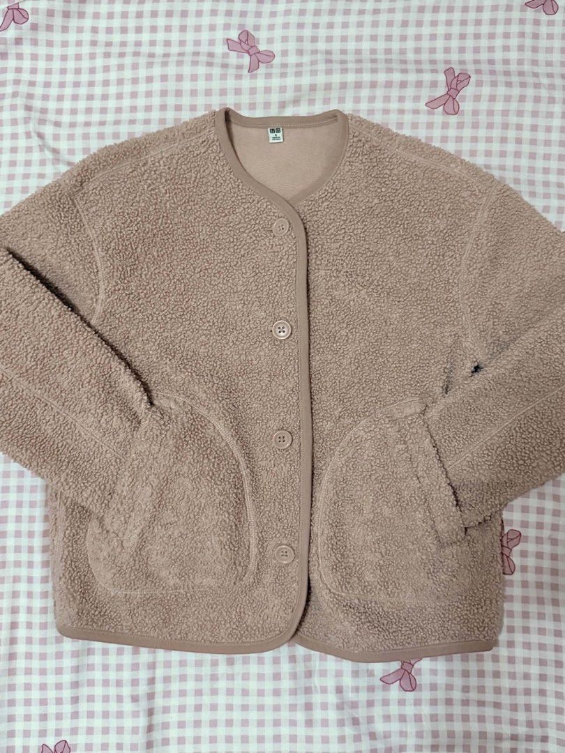 Uniqlo Pile Lined Jacket (Category: Coats, Jackets and Outerwear) located in Calasiao. Submitted by coldje (Listing ID 1458317759, Image 1). Description: - Super soft and cozy Uniqlo jacket - Light pinkish-brown color - Button-up front with pockets - Ideal for layering - Perfect for chilly days - Easy to wear and comfortable.
