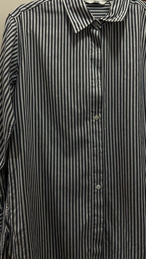 Uniqlo Striped Button-Down Shirt (Long Sleeve) (Category: Longsleeves) located in Batangas. Submitted by thecuratedrack_ph (Listing ID 1458403343, Image 3). Description: Classic navy blue and white pinstripe button-down, collared, long sleeves with button cuffs. Lightweight cotton fabric — easy to dress up for work or style down for a casual look..