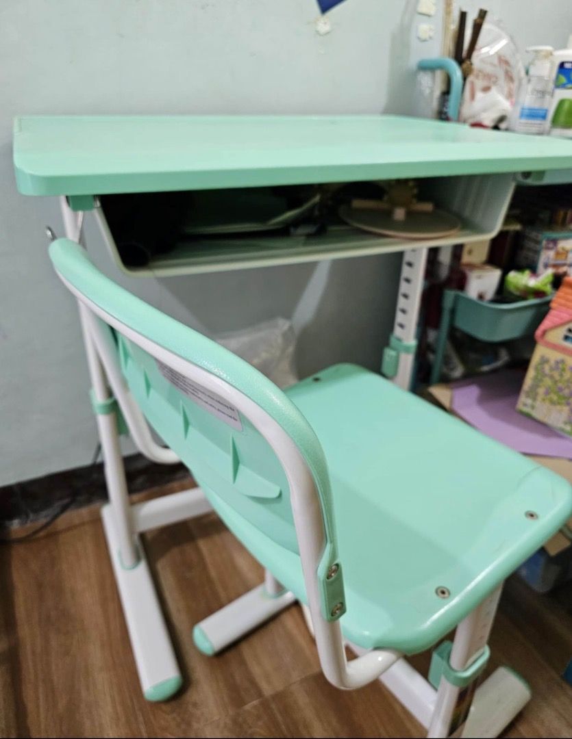 Used children’s study table and chair (Category: Tables & Sets) located in Quezon City. Submitted by oddturtle_bf507a (Listing ID 1458376640, Image 2). Description: Made of plastic and metal. Chair can carry up to 60kilos..