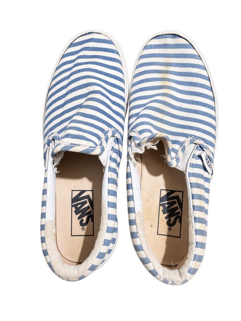 Vans Slip-On Striped Canvas Shoes (Category: Sneakers) located in Manila. Submitted by bini_19 (Listing ID 1458429269, Image 1). Description: - Classic Vans slip-on shoes - Blue and white stripe pattern - Durable canvas material - Shows some signs of wear on insoles and fabric edges - Plenty of life remaining for continued use - Ideal for casual everyday wear.