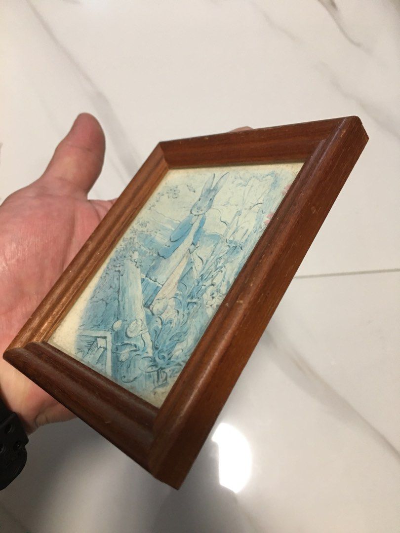 Vintage Peter Rabbit Framed Picture Art (Category: Frames & Pictures) located in Pasay City. Submitted by gilbertso62551 (Listing ID 1458397257, Image 3). Description: - Adorable framed Peter Rabbit artwork. - Sturdy wooden frame. - Compact size, ideal for any space. - Features a charming vintage blue and white design. - Perfect for nurseries, kids' rooms, or home decor. - As is,where is - Excellent .