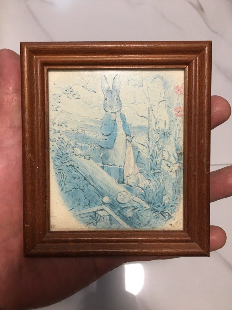 Vintage Peter Rabbit Framed Picture Art (Category: Frames & Pictures) located in Pasay City. Submitted by gilbertso62551 (Listing ID 1458397257, Image 1). Description: - Adorable framed Peter Rabbit artwork. - Sturdy wooden frame. - Compact size, ideal for any space. - Features a charming vintage blue and white design. - Perfect for nurseries, kids' rooms, or home decor. - As is,where is - Excellent .