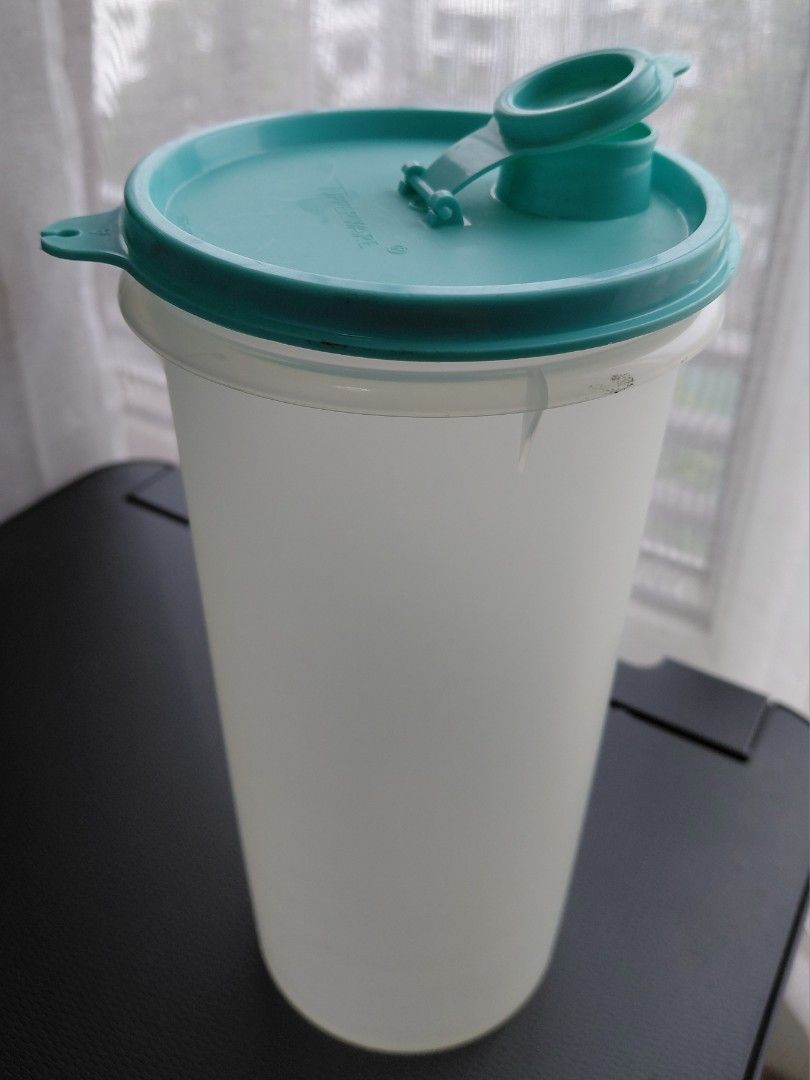 VINTAGE Tupperware Liquid Dispenser Pitcher (Category: Food Organization & Storage) located in Quezon City. Submitted by girldolphin (Listing ID 1458384774, Image 1). Description: This is a used item, please manaage expectations. Measurements: - 8 inches tall; - 4 inches wide Mode of Payment: BPI GCASH Maribank Near Amoranto Sports Complex, Timog, Morato.