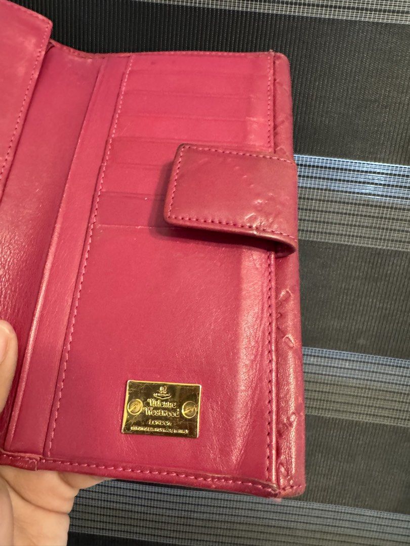 Vivienne Westwood Wallet (Category: Luxury Bags & Wallets) located in General Mariano Alvarez. Submitted by kuhwenyyy (Listing ID 1458331339, Image 3). Description: Authentic Vivienne Westwood Long Flap Wallet Front flap closure with gold tone Vivienne Westwood Orb emblem Made in Italy Lightly used with minor signs of wear.