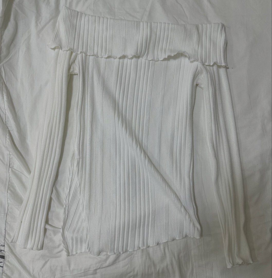 White Off-Shoulder Ribbed Long Sleeve Top (Category: Longsleeves) located in Bulacan. Submitted by enha4lyf (Listing ID 1458414610, Image 1). Description: - White off-shoulder top - Long, fitted sleeves - Ribbed texture all over - Ruffled trim on neckline - Casual and chic style - Versatile for dressing up or down.