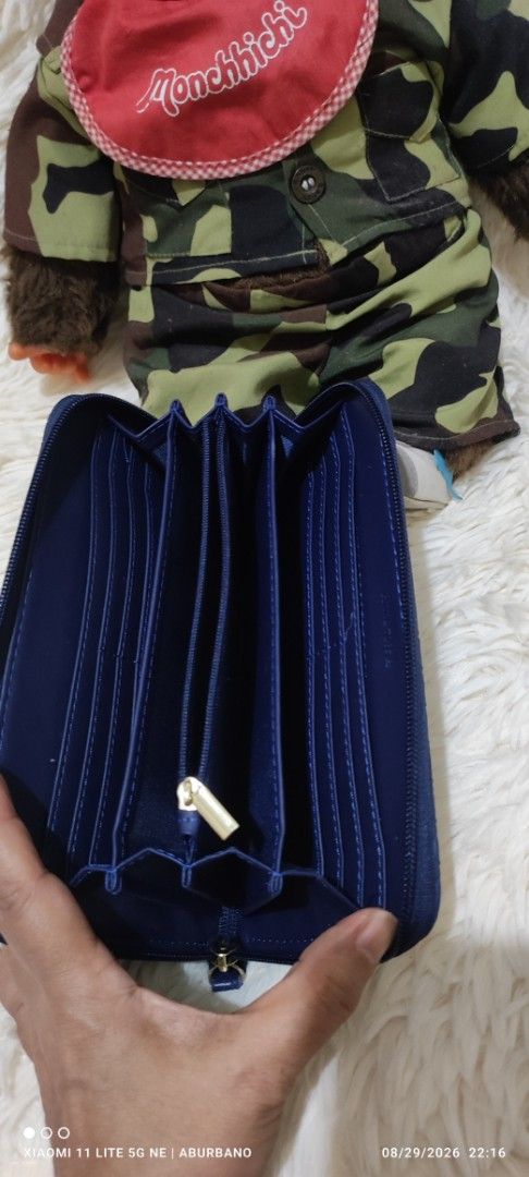 Woven zip around wallet (not Bottega) (Category: Wallets & Card holders) located in Makati City. Submitted by yerbua103 (Listing ID 1458446480, Image 3). Description: This wallet in navy blue woven leather zip-around long wallet features an intricate intrecciato weave, has 5 compartments and an ample card slots. Manage your expectations as you're buying a preloved/ukay wallet. Disclaimer: No copyright/ infringement is intended. the brand belongs 