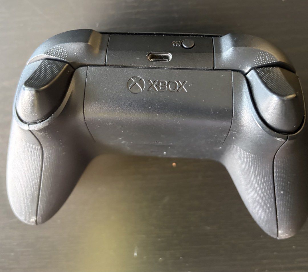 Xbox Wireless Controller (Category: Controllers) located in Singapore. Submitted by vroomvroom123 (Listing ID 1458370267, Image 2). Description: - Black Xbox Wireless Controller - Standard button layout (Share, Options, View) - USB-C charging port - Fully functional, works great.