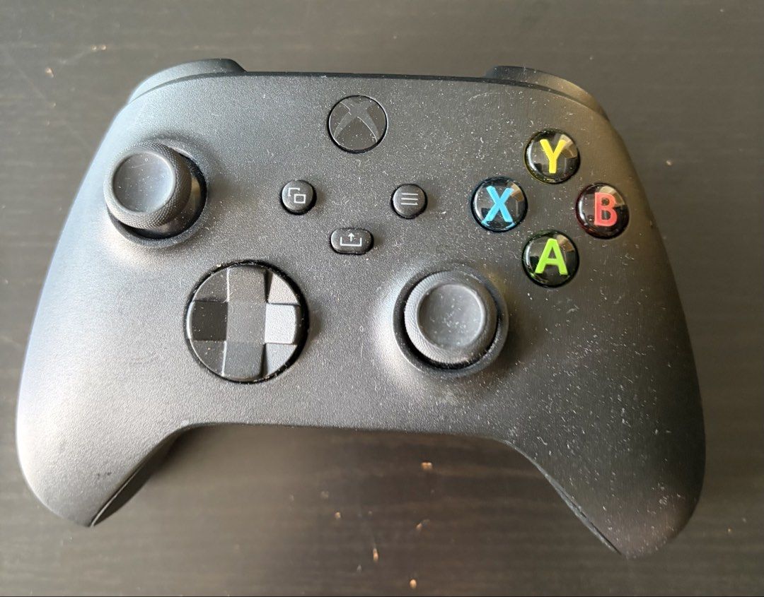 Xbox Wireless Controller (Category: Controllers) located in Singapore. Submitted by vroomvroom123 (Listing ID 1458370267, Image 1). Description: - Black Xbox Wireless Controller - Standard button layout (Share, Options, View) - USB-C charging port - Fully functional, works great.