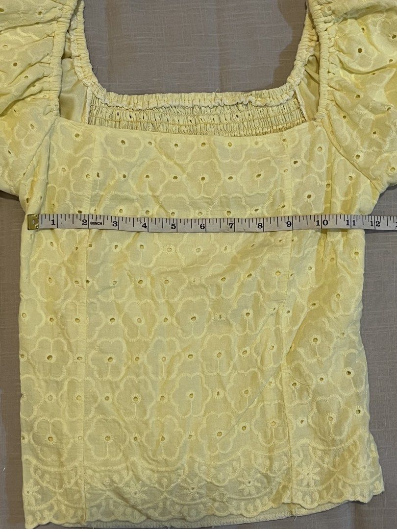 Yellow Eyelet Puff Sleeve Square Neck Top (Category: Blouses) located in Makati City. Submitted by declutterine95 (Listing ID 1458480368, Image 3). Description: 📍I am based in Makati 💡 Color may vary slightly due to lighting 🤍 Please manage expectations (preloved items) 📩 Message for more photos/measurements 🚚 Shipping shouldered by buyer.