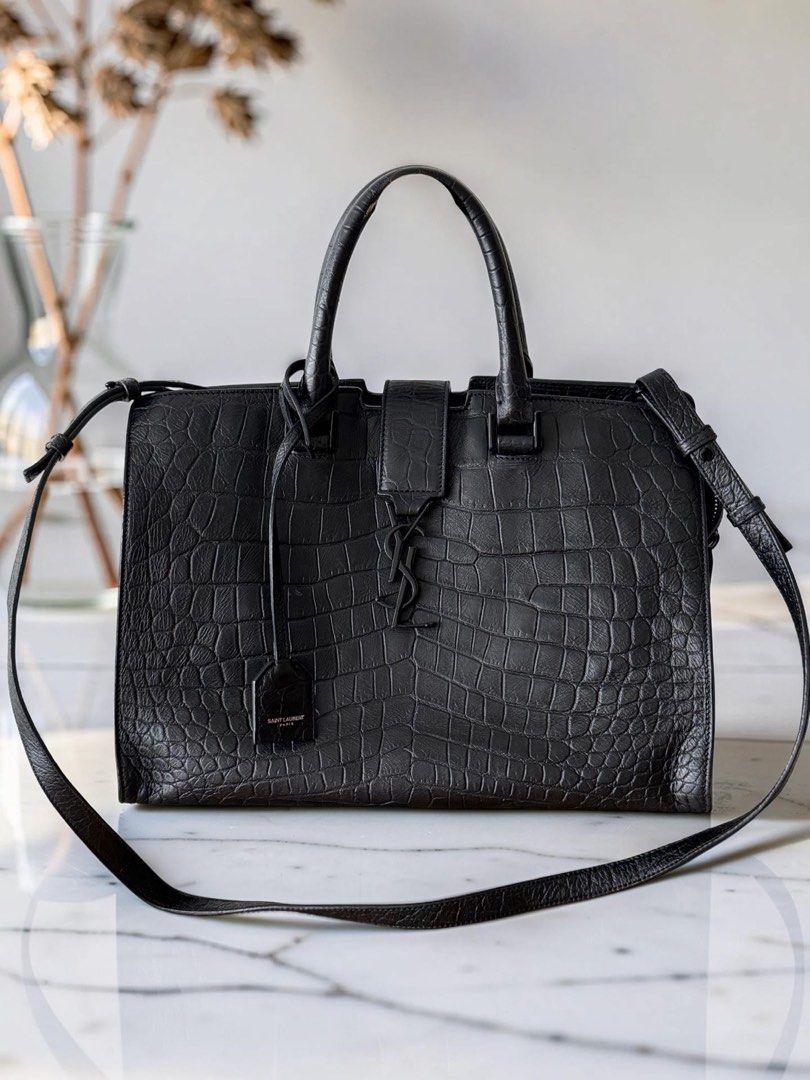 YSL Monogram Cabas Croc (Category: Luxury Bags & Wallets) located in Makati City. Submitted by theladyluxxe (Listing ID 1458441030, Image 1). Description: 🏷️ P60k YSL Cabas Croc Embossed ✨ RANK A Comes with strap cards & dust bag Can be worn top handle or crossbody 💳 MOP: BPI/Bank Transfer/Gcash/Maya/Paypal DISCLAIMER: theladyluxxe is NOT AFFILIATED with any brand posted on this page. All rights, trademarks, and copyrights remain the property o