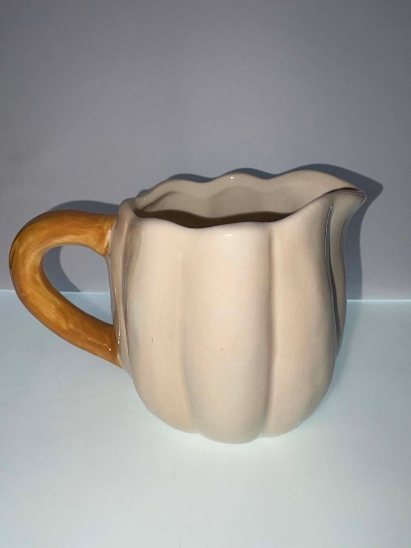 Abington Designs Ceramic Pumpkin Creamer Pitcher | Fall Harvest Decor (Category: Coffee & Tea Tableware) located in Caloocan City. Submitted by rabbithole2026 (Listing ID 1453589589, Image 3). Description: Description: Beautiful Abington Designs pumpkin-shaped ceramic creamer pitcher featuring a cream-colored pumpkin body with a brown stem handle. Perfect for serving cream, milk, syrup, or as a decorative piece for fall, Thanksgiving, or farmhous