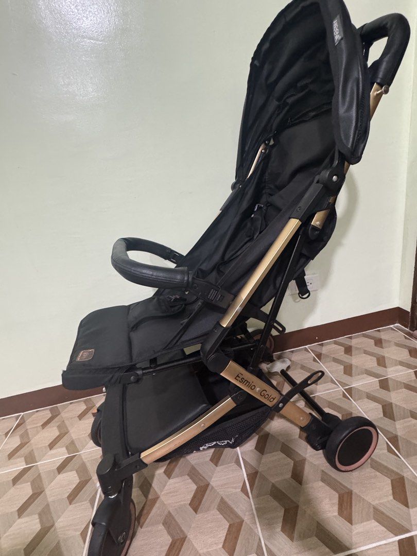 Akeeva X Evenflo (Esmio Gold) (Category: Strollers) located in Taytay. Submitted by rapdelcastillo (Listing ID 1453570434, Image 2). Description: Original Price: 9k+ Rate: 8.9/10 - Lightweight stroller in black with elegant gold accents. - Effortless folding mechanism for easy transport and storage. - Secure 5-point harness for your child's safety. - Adjustable canopy offers ample sun protection. - Convenient storage basket for essentials. - Idea
