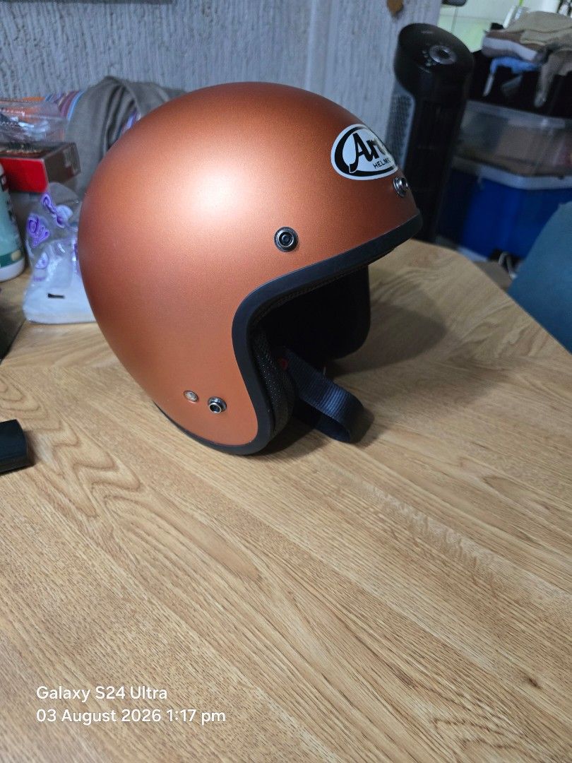 Arai Open Face Motorcycle Helmet - Copper (Category: Helmets and other Riding Gears) located in Mandaluyong City. Submitted by pilatus17 (Listing ID 1453478901, Image 2). Description: - Arai open face Mod helmet Japan Size 59-60 (Large) - Eye-catching copper color - Dark blue interior with Arai logo - Black chin strap with red accents - Ideal for comfortable and stylish riding - Purchased in Japan.