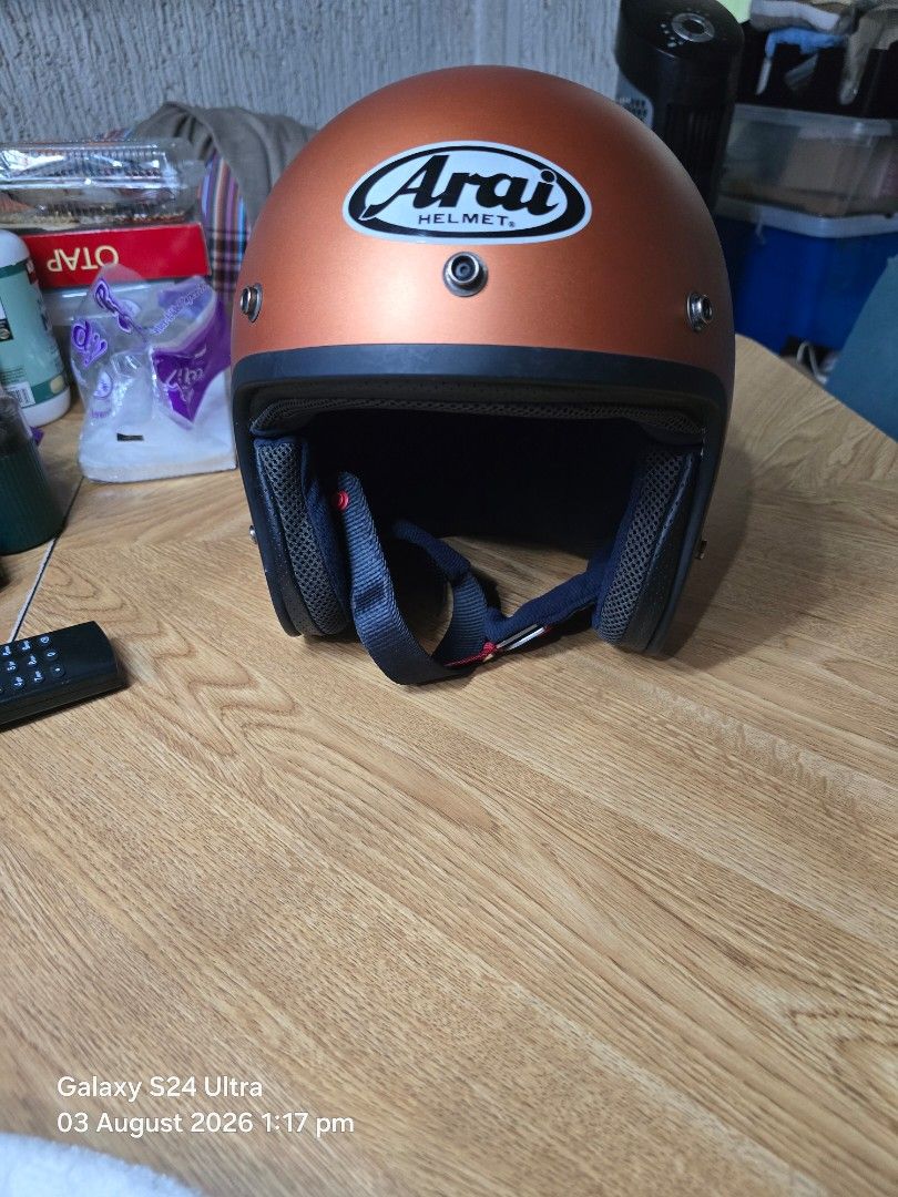 Arai Open Face Motorcycle Helmet - Copper (Category: Helmets and other Riding Gears) located in Mandaluyong City. Submitted by pilatus17 (Listing ID 1453478901, Image 1). Description: - Arai open face Mod helmet Japan Size 59-60 (Large) - Eye-catching copper color - Dark blue interior with Arai logo - Black chin strap with red accents - Ideal for comfortable and stylish riding - Purchased in Japan.