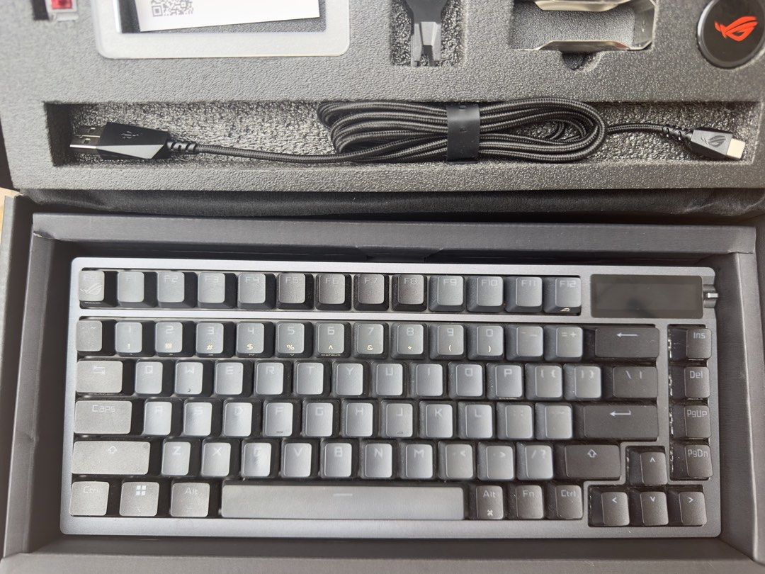 ASUS ROG STRIX AZOTH 75% OLED RGB Mechanical Keyboard (Category: Computer Keyboard) located in Manila. Submitted by cleverdolphin.6aaa13 (Listing ID 1453601807, Image 2). Description: - ASUS ROG Strix Azoth Keyboard Wireless RGB OLED 75% - Compact design, ideal for gaming and everyday use - Includes all original accessories, Lubing, and packaging Complete with Box - Comes with extra keycaps - Includes USB cable dongle - See all included in the pi