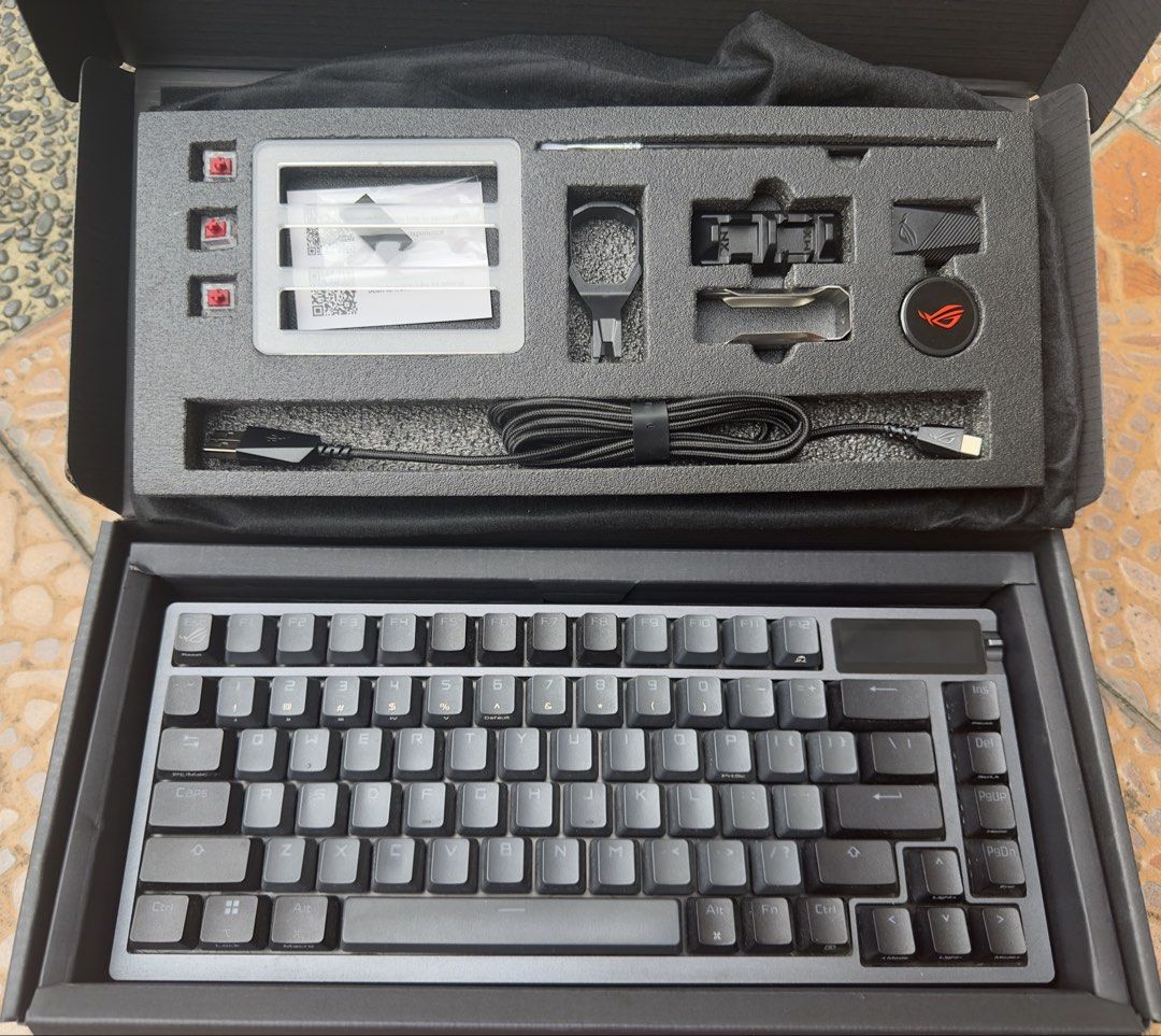ASUS ROG STRIX AZOTH 75% OLED RGB Mechanical Keyboard (Category: Computer Keyboard) located in Manila. Submitted by cleverdolphin.6aaa13 (Listing ID 1453601807, Image 1). Description: - ASUS ROG Strix Azoth Keyboard Wireless RGB OLED 75% - Compact design, ideal for gaming and everyday use - Includes all original accessories, Lubing, and packaging Complete with Box - Comes with extra keycaps - Includes USB cable dongle - See all included in the pi