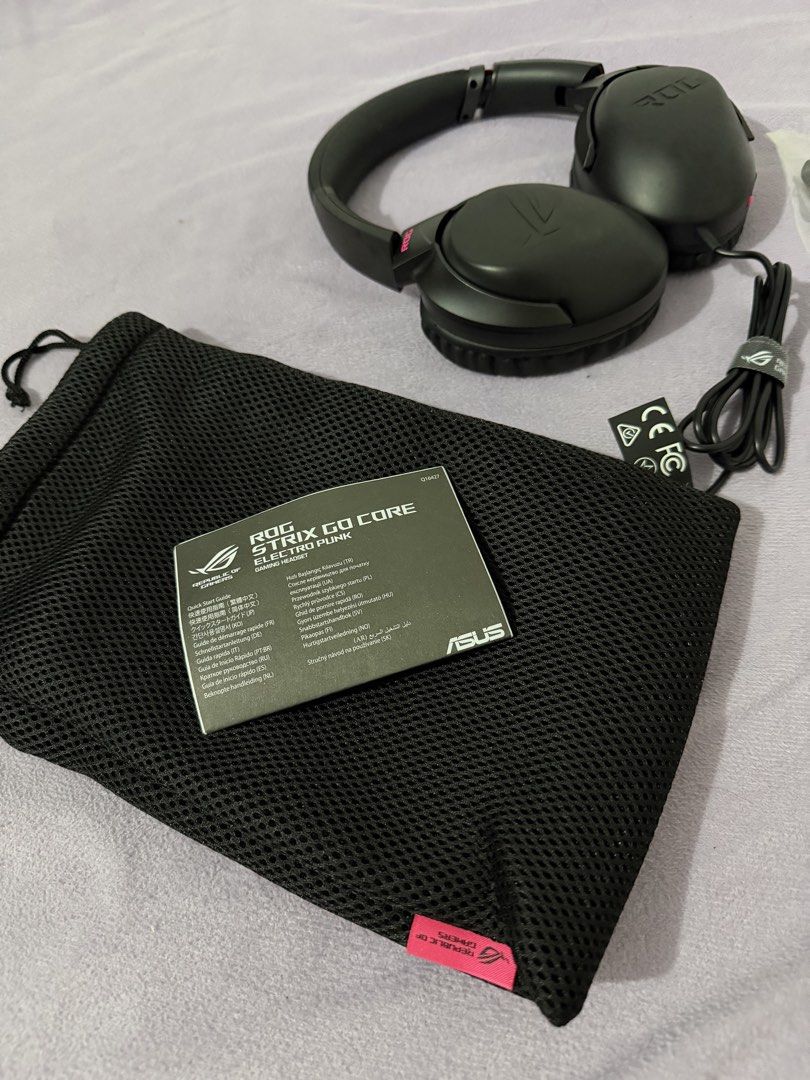 ASUS ROG Strix Go Core Gaming Headset (Category: Headphones & Headsets) located in Paranaque City. Submitted by ghostisher94311 (Listing ID 1453506658, Image 2). Description: - ASUS ROG Strix Go Core Gaming Headset - Color: Black with Pink Accents - Includes: Carrying Pouch and All Original Cables - Compatibility: PC, PlayStation, Nintendo Switch, Xbox - Features: Lightweight and Comfortable for Extended Gaming Sessions - Perfect for your next ga