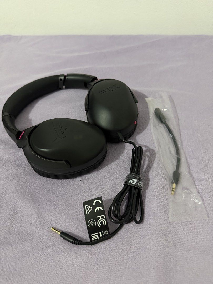 ASUS ROG Strix Go Core Gaming Headset (Category: Headphones & Headsets) located in Paranaque City. Submitted by ghostisher94311 (Listing ID 1453506658, Image 1). Description: - ASUS ROG Strix Go Core Gaming Headset - Color: Black with Pink Accents - Includes: Carrying Pouch and All Original Cables - Compatibility: PC, PlayStation, Nintendo Switch, Xbox - Features: Lightweight and Comfortable for Extended Gaming Sessions - Perfect for your next ga