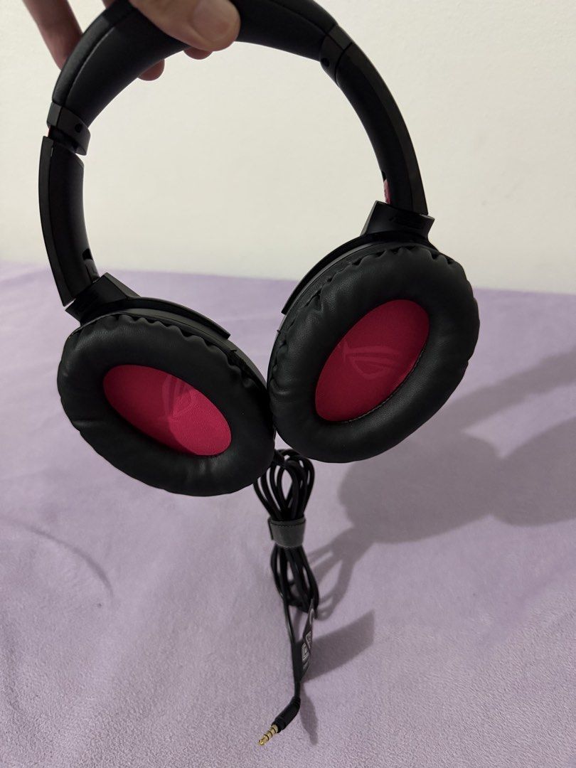 ASUS ROG Strix Go Core Gaming Headset (Category: Headphones & Headsets) located in Paranaque City. Submitted by ghostisher94311 (Listing ID 1453506658, Image 3). Description: - ASUS ROG Strix Go Core Gaming Headset - Color: Black with Pink Accents - Includes: Carrying Pouch and All Original Cables - Compatibility: PC, PlayStation, Nintendo Switch, Xbox - Features: Lightweight and Comfortable for Extended Gaming Sessions - Perfect for your next ga