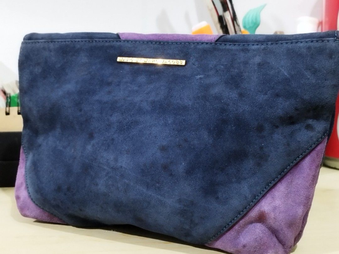 Authentic Marc by Marc Jacobs Etta Suede Patchwork Clutch Bag (Category: Luxury Bags & Wallets) located in Quezon City. Submitted by redragtag (Listing ID 1453443287, Image 2). Description: Selling an authentic, rare archival Marc by Marc Jacobs "Etta" Patchwork Clutch. Super unique geometric colorblock design made of soft suede panels (Navy, Purple, Jungle Green, and Black). A great evening statement piece from the discontinued MBMJ line! ✨ BONU