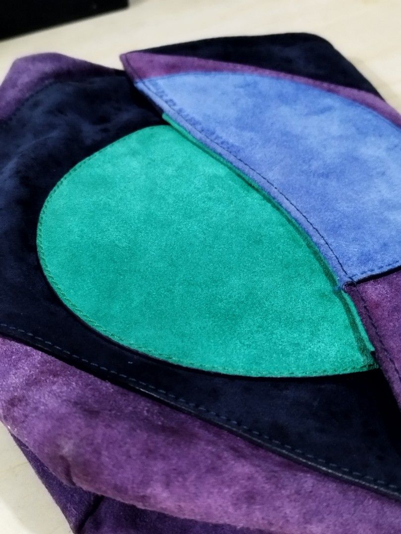 Authentic Marc by Marc Jacobs Etta Suede Patchwork Clutch Bag (Category: Luxury Bags & Wallets) located in Quezon City. Submitted by redragtag (Listing ID 1453443287, Image 3). Description: Selling an authentic, rare archival Marc by Marc Jacobs "Etta" Patchwork Clutch. Super unique geometric colorblock design made of soft suede panels (Navy, Purple, Jungle Green, and Black). A great evening statement piece from the discontinued MBMJ line! ✨ BONU