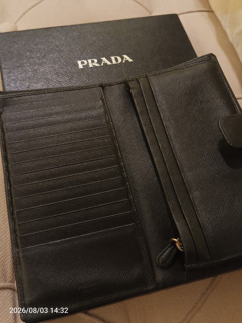 Authentic Prada Saffiano Leather Wallet (Category: Luxury Bags & Wallets) located in Quezon City. Submitted by lilynlace.thecoll (Listing ID 1453489133, Image 3). Description: PRICE: 9,000 This is an authentic Prada wallet. If proven fake, your money back guaranteed. Has an ever so slight flaw of minimal hardware discoloration. This features a textured crosshatch leather and a gold-tone zipper. Has multiple card slots, gold-tone hardware, and a z