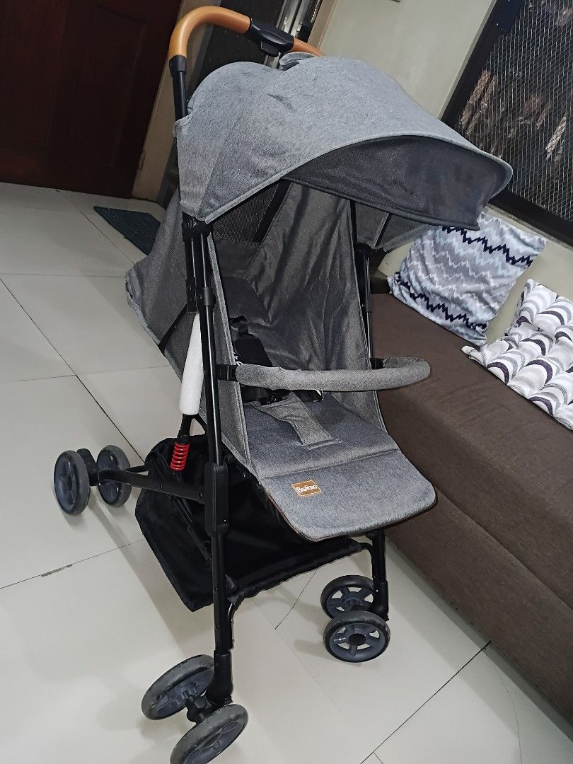 BabyGro F-lite Grey Stroller (Category: Strollers) located in Manila. Submitted by ThrineSo (Listing ID 1453540223, Image 2). Description: - Grey baby stroller - Features a canopy for sun protection - Includes a convenient storage basket - Stylish wooden finish on the handle - Folds compactly for easy storage - Black wheels.