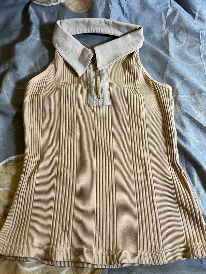 backless collared sleeveless top (Category: Blouses) located in Manila. Submitted by a22bee (Listing ID 1414683803, Image 1). Description: - Beige ribbed halter top - Polo collar - Zipper detail at neckline - Sleeveless design - Knit fabric - Vertical ribbed detailing mop: gcash mod: lalamove, angkas padala, jnt - can meet around dlsu.