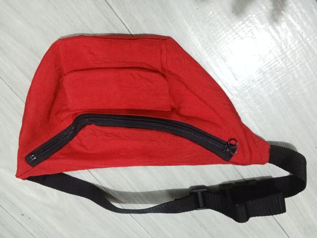 Belt / Waist Bag (Category: Luxury Bags & Wallets) located in Bocaue. Submitted by marajapansurplus (Listing ID 1453559303, Image 3). Description: - Classic red fanny pack - Main zippered compartment - Smaller front pocket - Adjustable strap with buckle closure - Ideal for keeping essentials handy - Great for travel or everyday use - Simple and functional design.