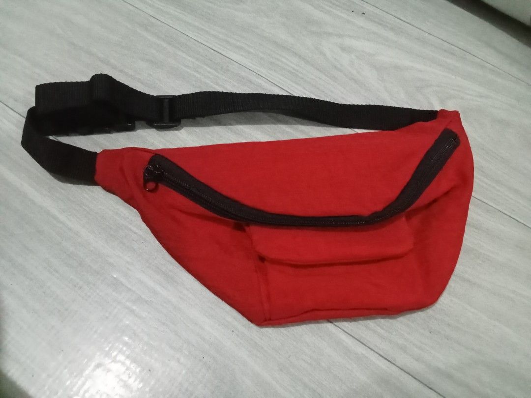 Belt / Waist Bag (Category: Luxury Bags & Wallets) located in Bocaue. Submitted by marajapansurplus (Listing ID 1453559303, Image 1). Description: - Classic red fanny pack - Main zippered compartment - Smaller front pocket - Adjustable strap with buckle closure - Ideal for keeping essentials handy - Great for travel or everyday use - Simple and functional design.