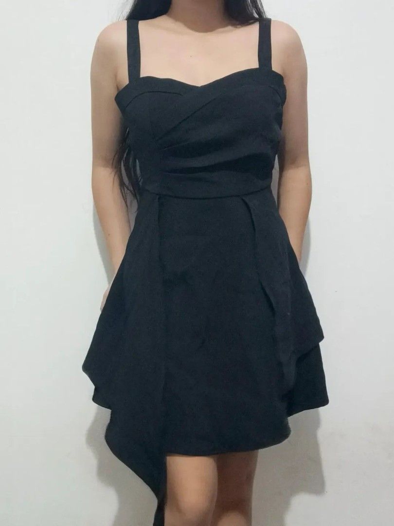 Black Asymmetrical Hem Dress with Spaghetti Straps (Category: Dresses) located in Quezon City. Submitted by alluring.avenue (Listing ID 1453481891, Image 2). Description: - Elegant black dress - S-M - Sweetheart neckline - Spaghetti straps - Asymmetrical, layered hemline - Fitted waist with flared skirt - Ideal for parties or nights out - Comfortable and stylish - Versatile for dressing up or down.