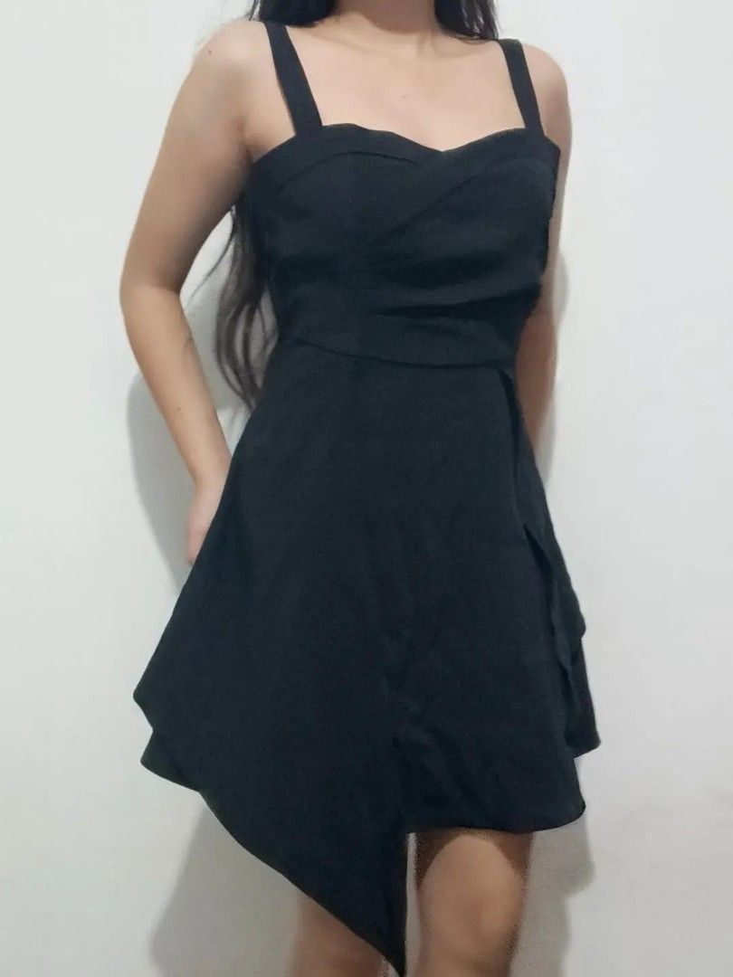 Black Asymmetrical Hem Dress with Spaghetti Straps (Category: Dresses) located in Quezon City. Submitted by alluring.avenue (Listing ID 1453481891, Image 3). Description: - Elegant black dress - S-M - Sweetheart neckline - Spaghetti straps - Asymmetrical, layered hemline - Fitted waist with flared skirt - Ideal for parties or nights out - Comfortable and stylish - Versatile for dressing up or down.