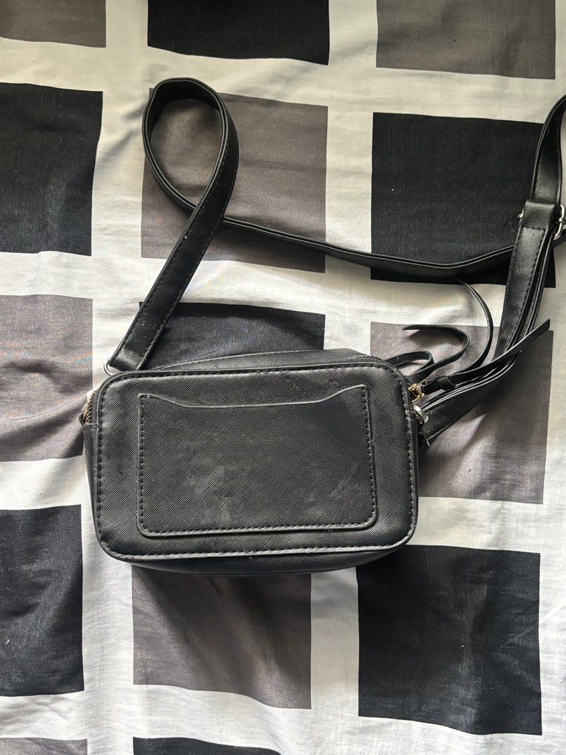 Black Crossbody Bag with Gold Hardware (Category: Cross-body Bags) located in Rizal. Submitted by itzpheebs (Listing ID 1453457313, Image 2). Description: Description: - Elegant gold oval detail on the front - Secure zipper closure - Adjustable and removable strap for comfortable wear - Handy back pocket for quick access Payment method: Gcash or Lalamove Delivery method (SHOULDERED BY BUYER): Lalamove or jnt.