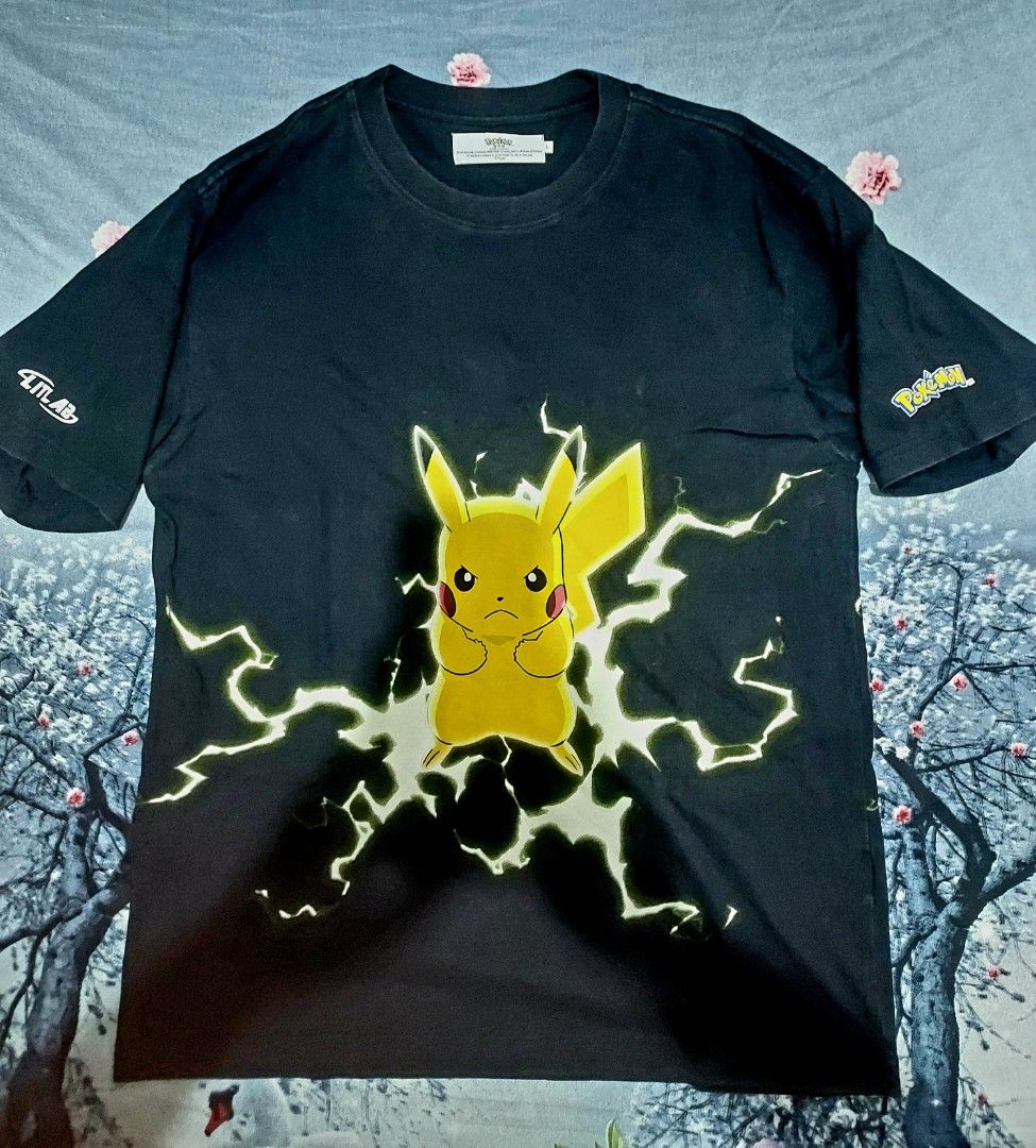 Black Pokemon Pikachu Lightning T-shirt (Category: Tshirts & Polo Shirts ) located in Tagbilaran City. Submitted by topernzvault (Listing ID 1453548609, Image 1). Description: - Black t-shirt with a striking Pikachu graphic - Features dynamic lightning effects around Pikachu - '4TLAB' logo on the left sleeve - Official Pokemon logo on the right sleeve - Comfortable and stylish design - Ideal for any Pokemon enthusiast.