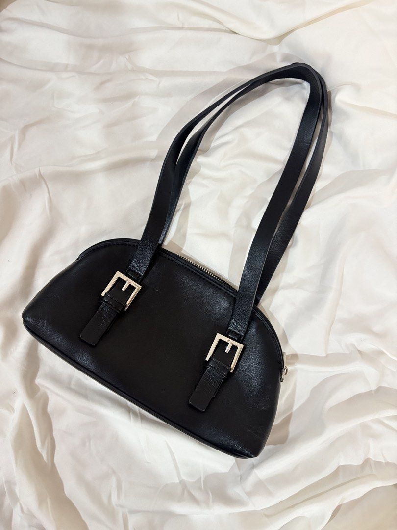Black Shoulder Bag with Silver Buckle Details (Category: Shoulder Bags) located in Marikina City. Submitted by beadc (Listing ID 1453550995, Image 2). Description: - Classic black shoulder bag - Two adjustable straps with silver buckle details - Zipper closure at the top - Simple and chic design - Comfortable shoulder fit - Ideal for everyday use.