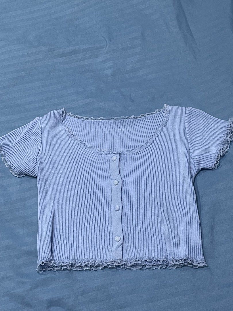 Blue Ribbed Button-Up Top with Lace Trim (Category: Blouses) located in Marikina City. Submitted by flutterchi (Listing ID 1453583826, Image 1). Description: - Blue ribbed knit cardigan - Short sleeves with delicate lace trim - Functional front buttons - Lace detailing along the neckline and hem - bought in 🍊 app rfs: don't wear anymore.