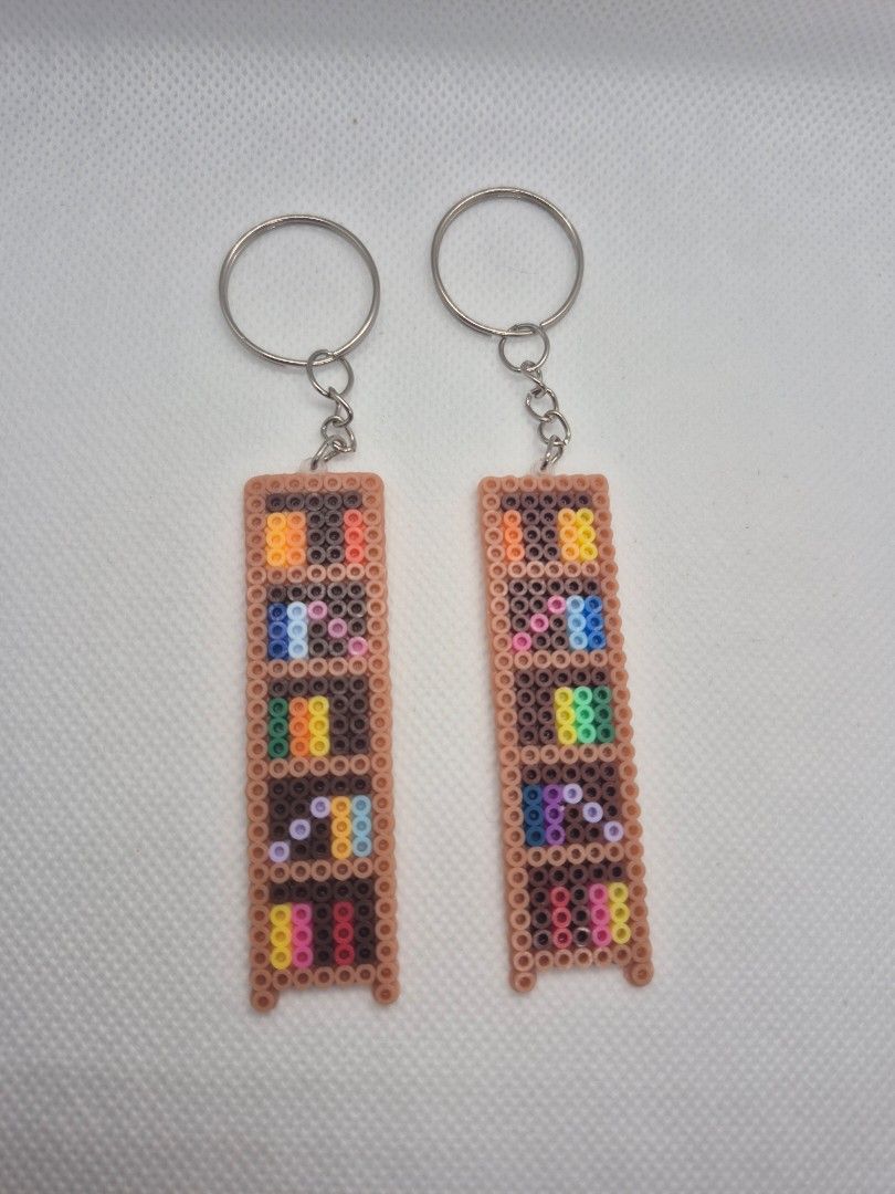 Bookshelf Keychain (Category: Handmade Craft) located in Santa Rosa. Submitted by what.the.book (Listing ID 1453615309, Image 1). Description: 🍂 Perler bead bookshelf keychain 🍂 PHP 45 each.